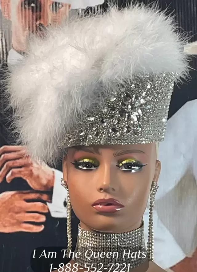 "Image of a stylish pillbox church hat featuring rhinestone embellishments and delicate white feathers, representing a timeless symbol of fabulous fashion."